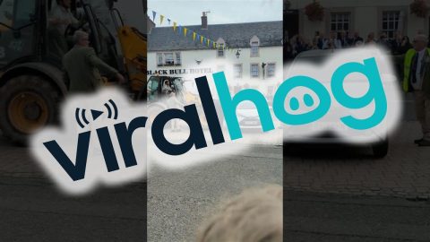 Locals Take Matters Into Their Own Hands When Parked Car Interrupts Festival || ViralHog