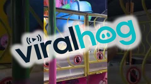 Carnival Ride Hilariously Traps Woman On Moving Walkway || ViralHog