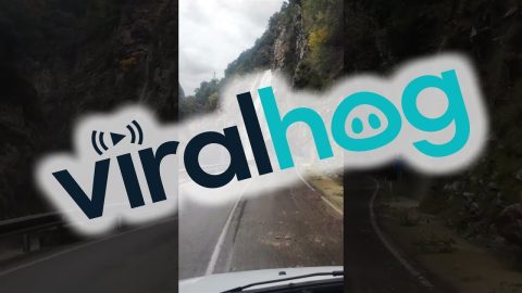 Heavy Rain Creates a Waterfall Over Road || ViralHog
