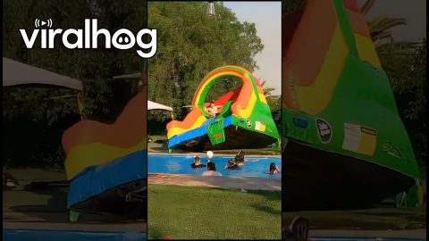 Man Overturns Inflatable Slide || ViralHog
