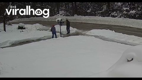 Man Slides Down Icy Driveway and Falls || ViralHog
