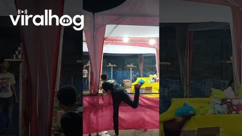 Carnival Game Player Falls Over Railing || ViralHog