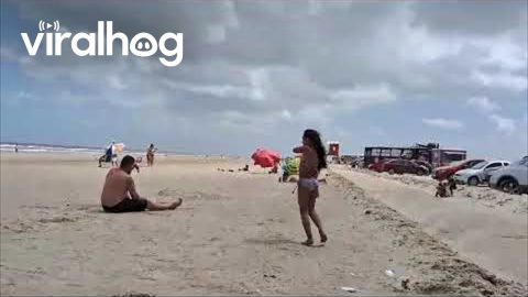 Man Falls Trying to Pass Soccer Ball at the Beach || ViralHog