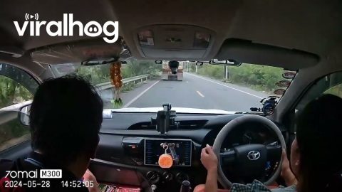 Passing Truck Sends Stray Rock Flying Into Windshield || ViralHog