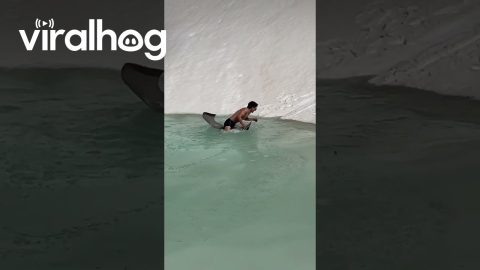 Gliding Down Snowy Slope Into Mountain Water || ViralHog