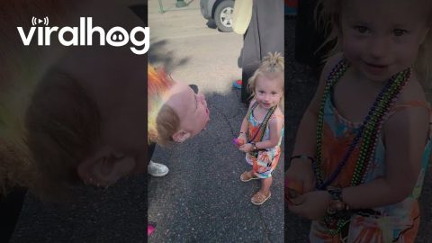 Kid Models Giant Punk Rock Baby Mask || ViralHog