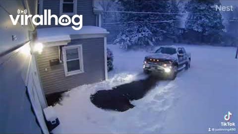 Pickup Slides Out of Icy Driveway || ViralHog