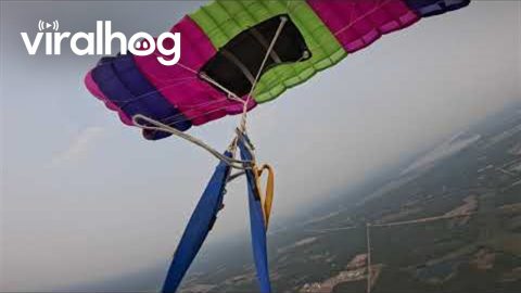 Skydiver Cuts Away Tangled Parachute || ViralHog