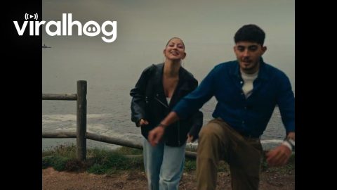 Couple Nearly Falls When Fence Breaks at Edge of Cliff || ViralHog