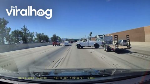 Narrowly Avoiding a Jackknifing Trailer on the Freeway || ViralHog