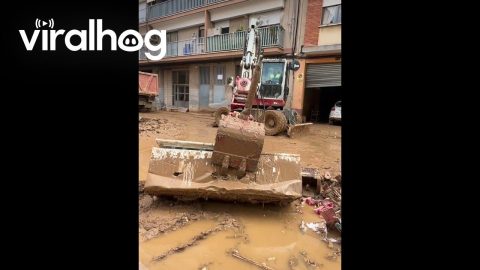 Excavator Operator Uses Refrigerator As Broom During Cleanup Efforts || ViralHog