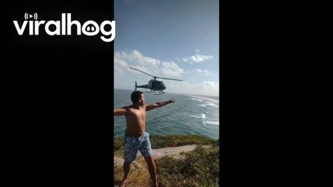 Police Helicopter Cooperates With Posing Tourists || ViralHog
