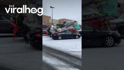 Belongings Strapped Precariously To Sedan Roof || ViralHog
