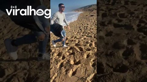 Man Hilariously Runs From Oncoming Wave || ViralHog