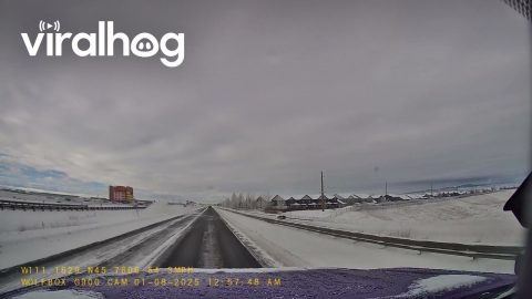 Truck Loses Control On Black Ice Bridge || ViralHog