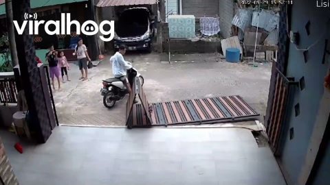 Fence Falls as Motorcyclist Exits Building || ViralHog