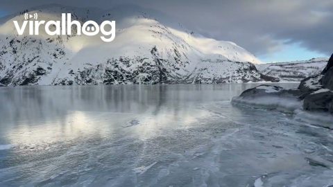 Glacier Breaks Onto Frozen Lake || ViralHog