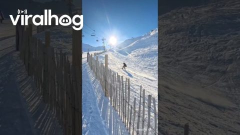 Snowboarder Crashes Over Fence || ViralHog
