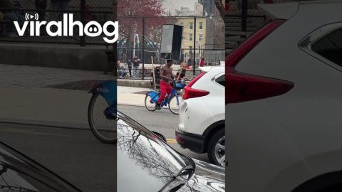 Man Rides Bike While Balancing a Fridge on His Head || ViralHog