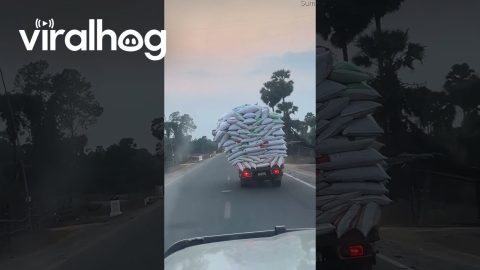 Truck's Unbalanced Load Of Leaning Bags || ViralHog