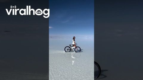 Woman Rides Bike At Bolivia's Salar de Uyuni || ViralHog
