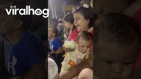 Sports Game Distracts From Bottle Feeding Baby || ViralHog