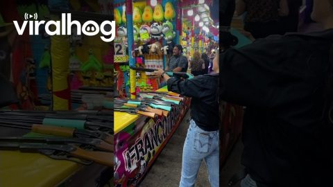 Sharpshooter Takes Aim at Carnival Game || ViralHog
