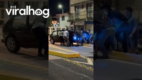 Group of Men Lift a Car Back Over Median || ViralHog