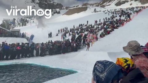 Skier and Inflatable Friends Compete in Pond Skim || ViralHog
