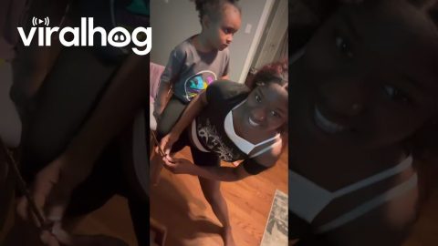 Super Stylist Balances Baby While Braiding at Top Speed || ViralHog