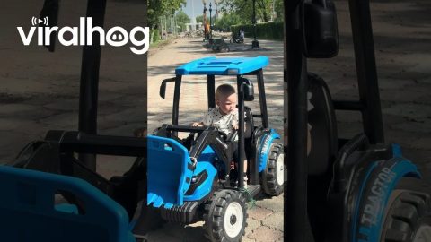Girl Falls Asleep at the Wheel of a Toy Tractor || ViralHog