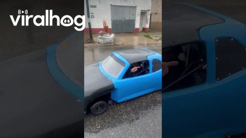 Miniature Car Goes For Rainy Cruise || ViralHog