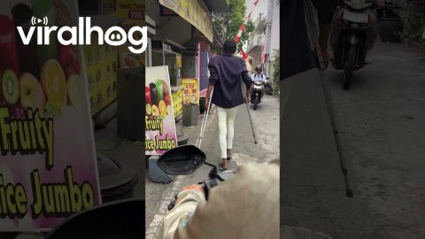 Walking Man Casually Holds Crutches Out || ViralHog