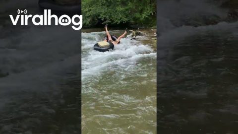 River Tubing Man Tips Over || ViralHog