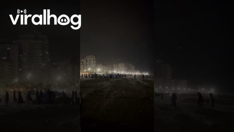 Sudden Surge of Wind Takes Beachgoers by Surprise || ViralHog