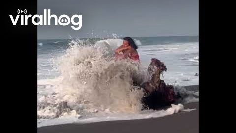 Whimsical Woman Gets Tossed by the Sea || ViralHog