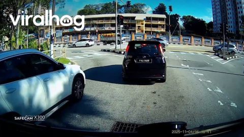 Section of Malaysian Road Drops Into Widening Sinkhole || ViralHog