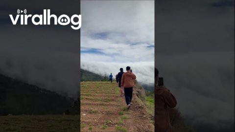Cloud waterfall tumbles over mountain ridge in the Philippines || ViralHog