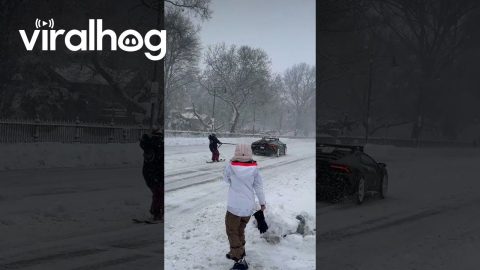 Lamborghini Huracan Pulling a Skier Down Snow-Covered Street || ViralHog