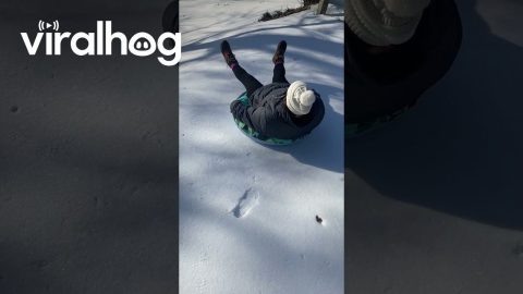 Snow Tubing Fail Flips Toy Tractor And Hits Fence || ViralHog
