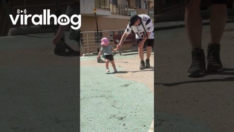Dad Keeping His Little Girl Steady After a Dizzying Spin at the Park || ViralHog