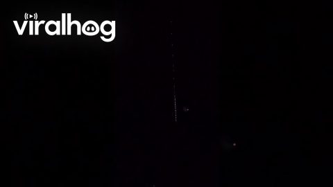 Bright Object Crosses Satellite Path In Night Sky || ViralHog