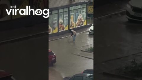 Man Crosses Flooded Street on a Ladder || ViralHog