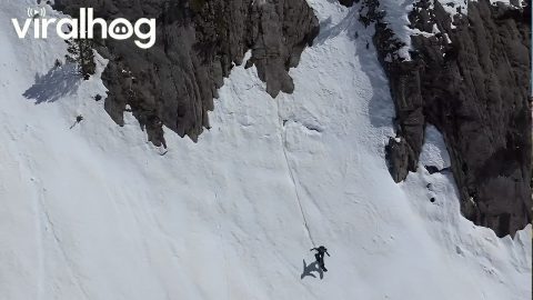Snowboarding on Top of a Slab Rock While My Dog Waits for Me || ViralHog