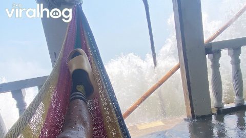 Big Wave Soaks Seashore Relaxation || ViralHog